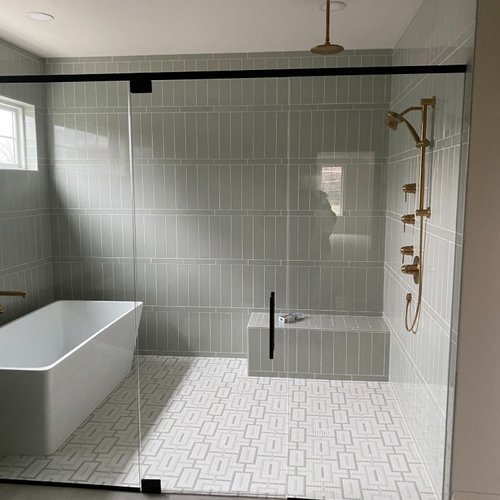 Stylish grey tiles in a serene bathroom by Adair's Flooring