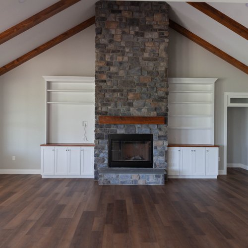 New home in Lititz, PA with stone fireplace installed by Adair's Flooring