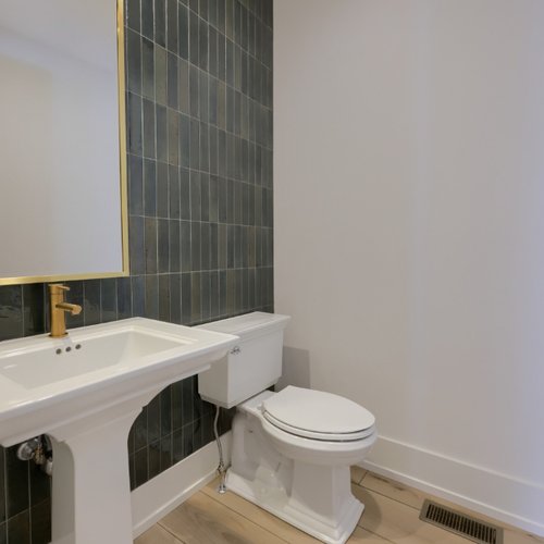 Contemporary grey tile in a remodeled bathroom