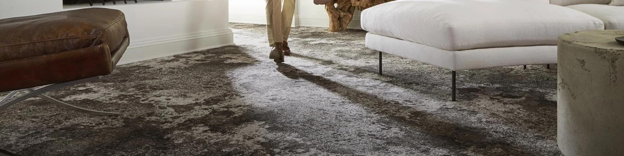 Person walking on modern patterned carpet