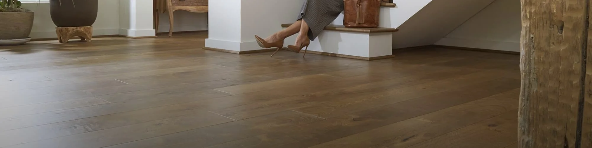 Elegant hardwood flooring installed in open concept hallway