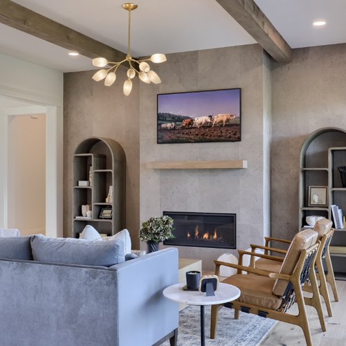 Stylish stone fireplace in a modern Lititz, PA home by Adair's Flooring